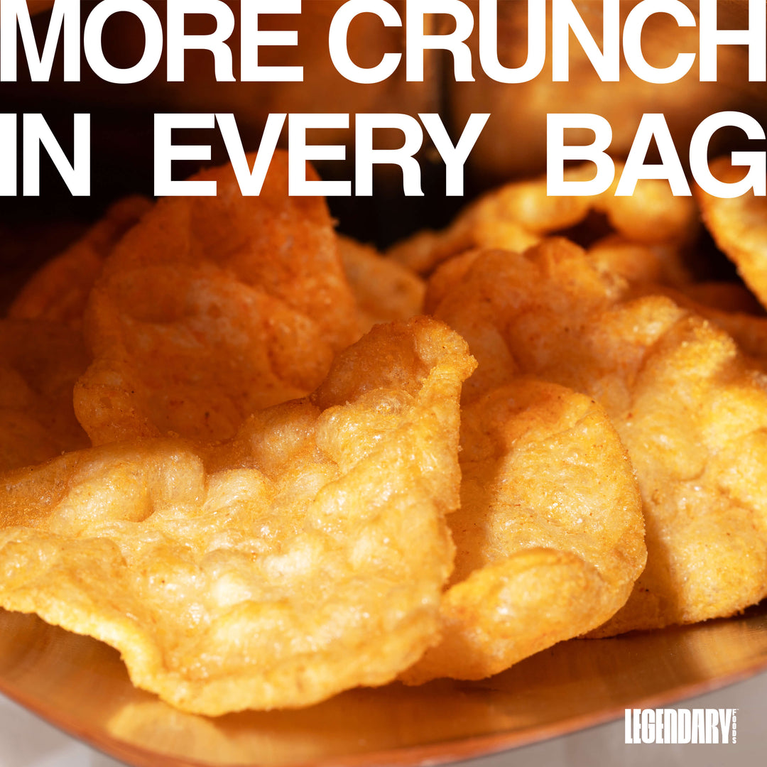 Close-up of Nacho Cheese Popped Protein Chips inside an open bag with text reading "More Crunch In Every Bag."