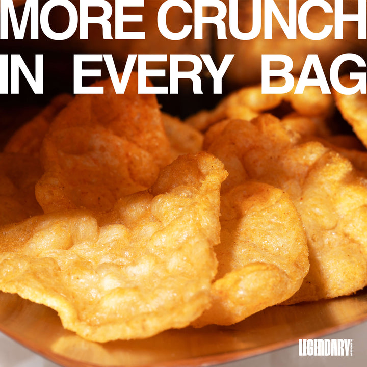 Close-up of Nacho Cheese Popped Protein Chips inside an open bag with text reading "More Crunch In Every Bag."
