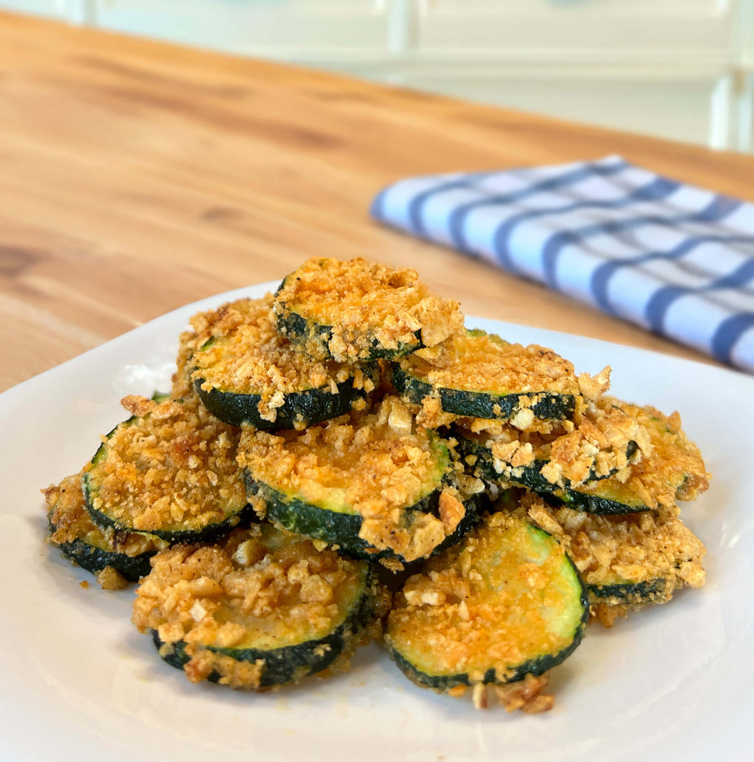 Golden, crispy chicken tenders served with a side of green beans, showcasing a flavorful and protein-packed meal