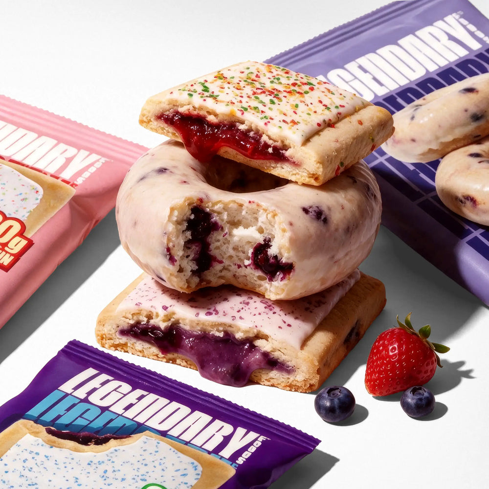 Image of Berry Bundle - containing one unwrapped strawberry protein pastrie, one unwrapped blueberry protein pastry, and one unwrapped  blueberry protein donut with their wrappers behind them
