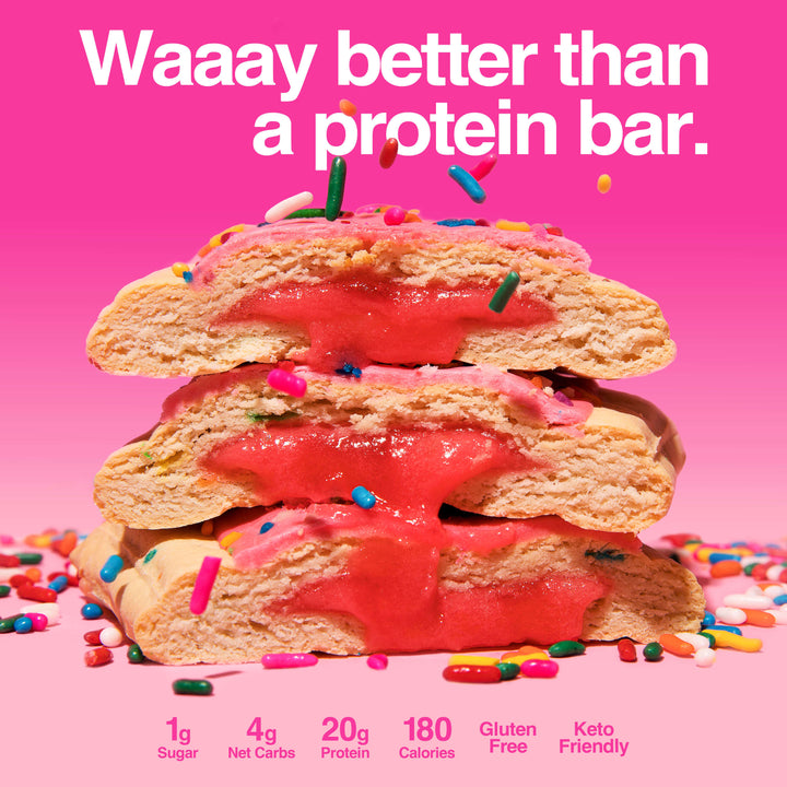Stack of sliced birthday cake pastries oozing pink filling, surrounded by colorful sprinkles. Text reads "Waaay better than a protein bar."