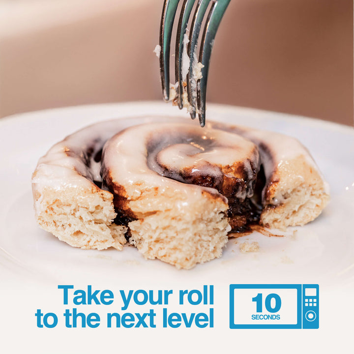 Fork cutting into warm Cinnamon Protein Roll. Text: "Take your roll to the next level. 10 seconds."