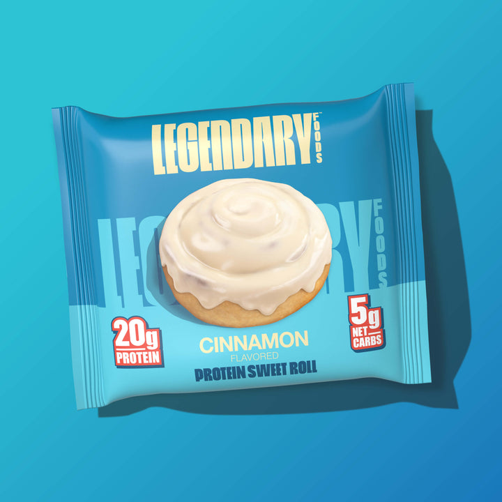 Packaged Cinnamon Protein Sweet Roll with white icing. Text: "20g Protein, 5g Net Carbs."