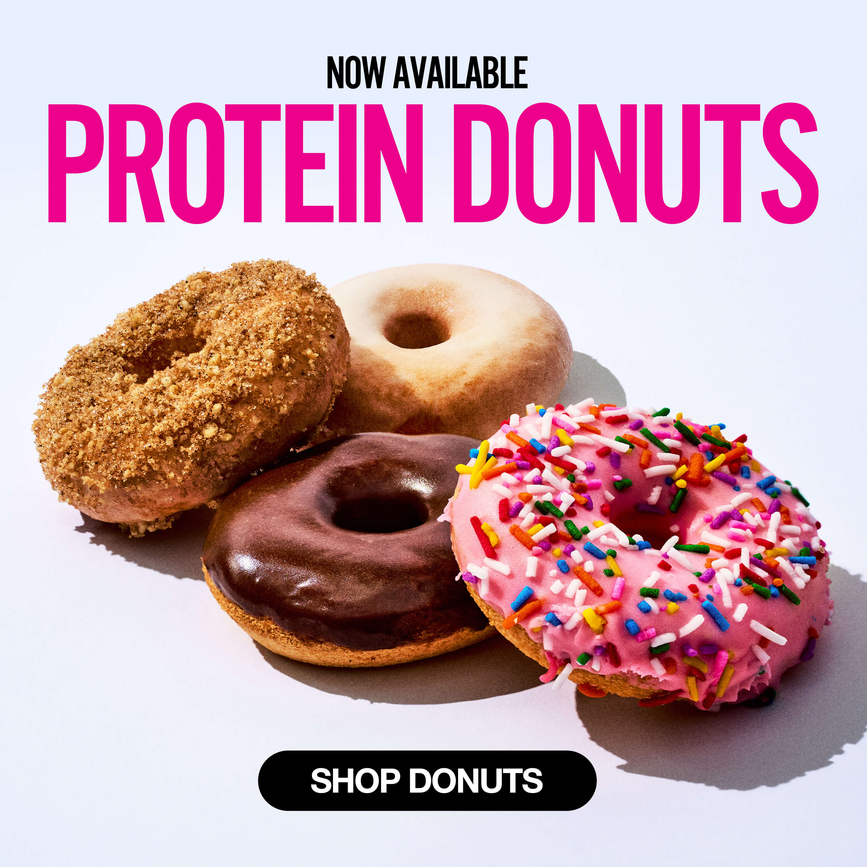 Group of four protein donuts under text that says 'Now Available Protein Donuts' with a black button reading 'Shop Donuts.'