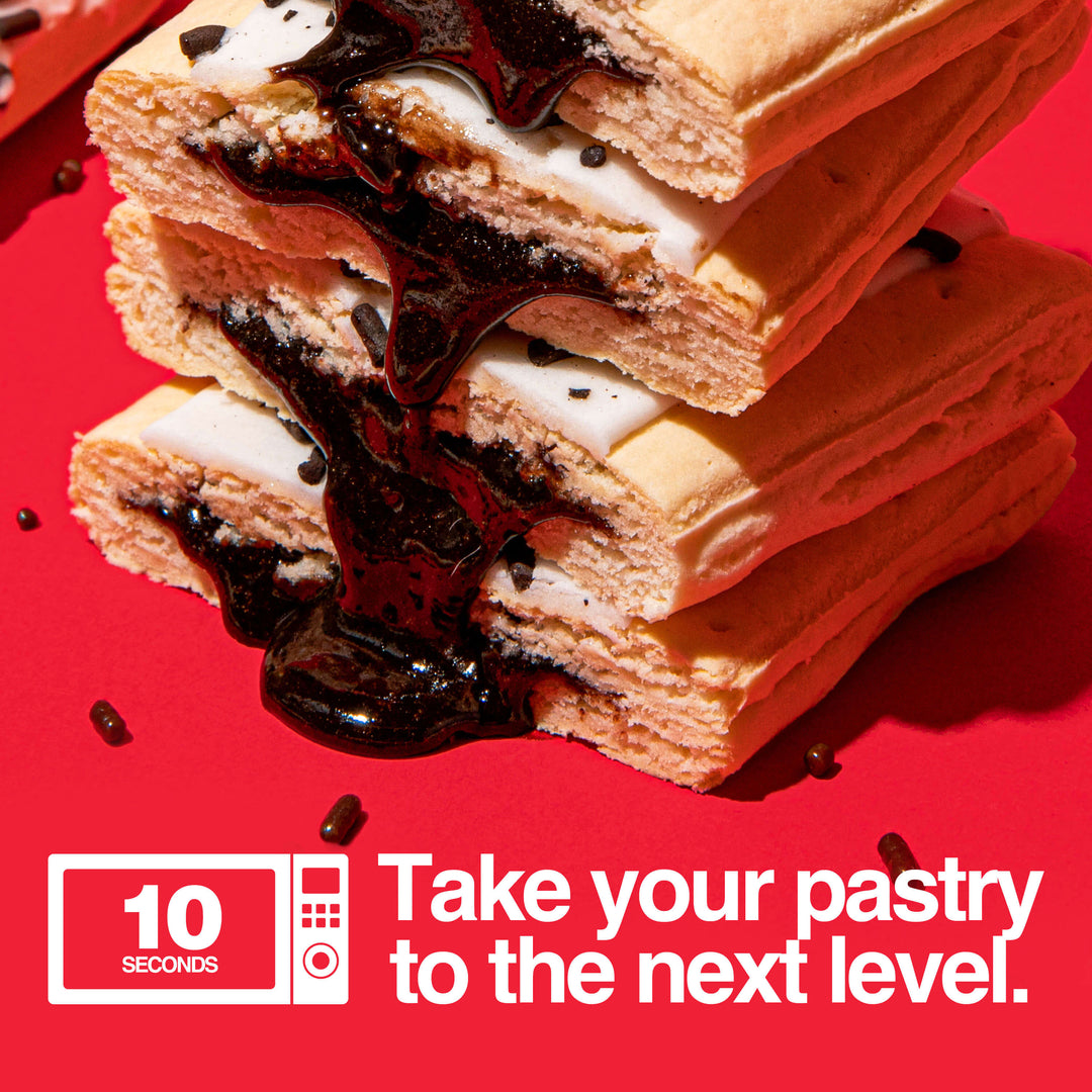 Image of stacked and gooey hot fudge sundae protein pastries. Text with microwave icon that reads "take your pastry to the next level" with a 10 second microwave icon.