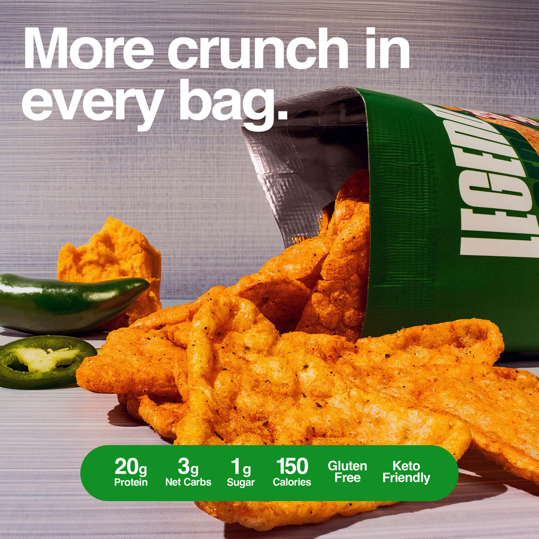Open chip bag spilling out crispy orange protein chips with jalapeños and cheese, text reads “More crunch in every bag.”