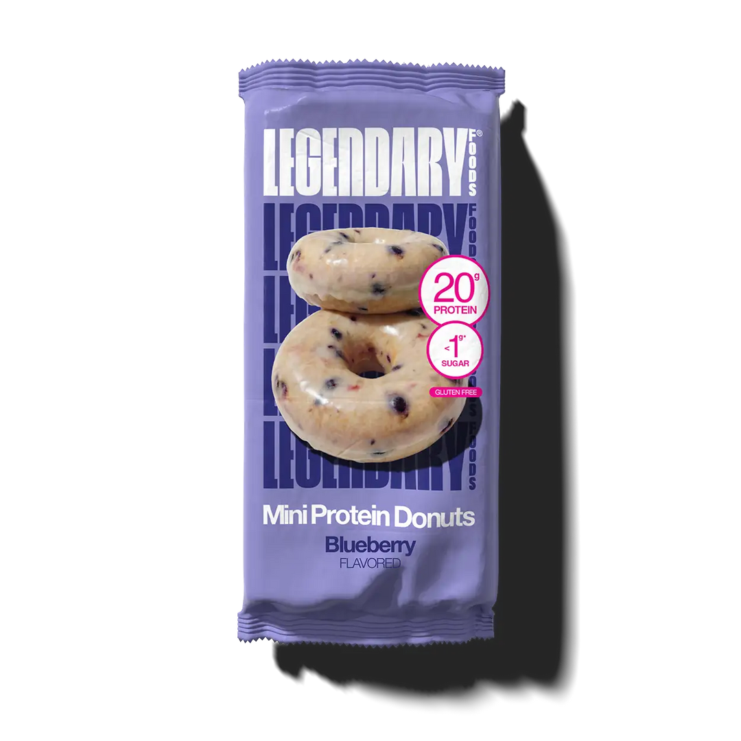Purple package of Legendary Mini Protein Donuts with blueberry flavor on a white background