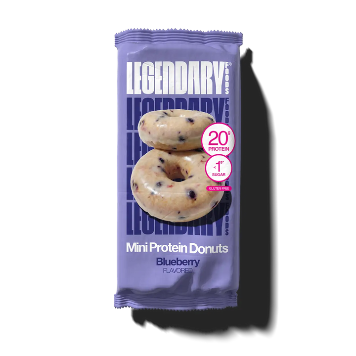 Purple package of Legendary Mini Protein Donuts with blueberry flavor on a white background