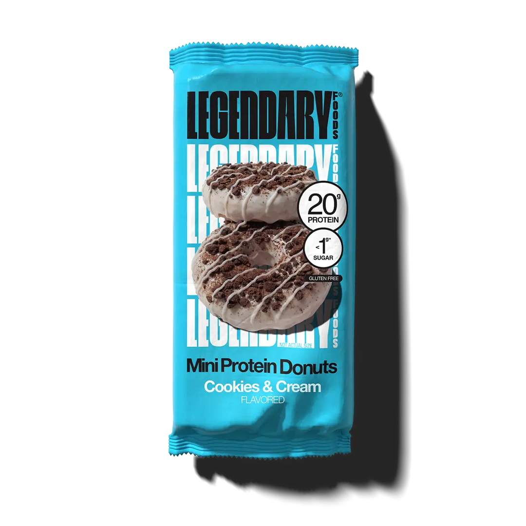 Legendary Foods Cookies & Cream Mini Protein Donuts in an individual blue package, featuring 20g protein, less than 1g sugar and gluten free.