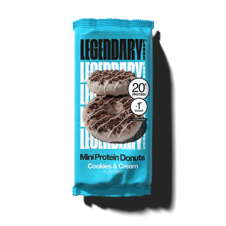 Legendary Foods Cookies & Cream Mini Protein Donuts in an individual blue package, featuring 20g protein, less than 1g sugar and gluten free.