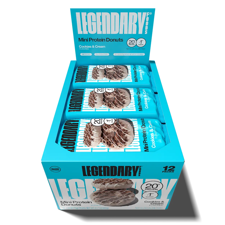 Open 12-pack box of Legendary Foods Cookies & Cream Mini Protein Donuts with individually wrapped donut packs inside.