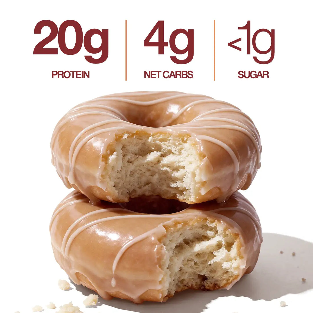 Two Maple Glazed Mini Protein Donuts with glossy maple glaze and white drizzle, shown with 20g protein, 4g net carbs and less than 1g sugar callouts.