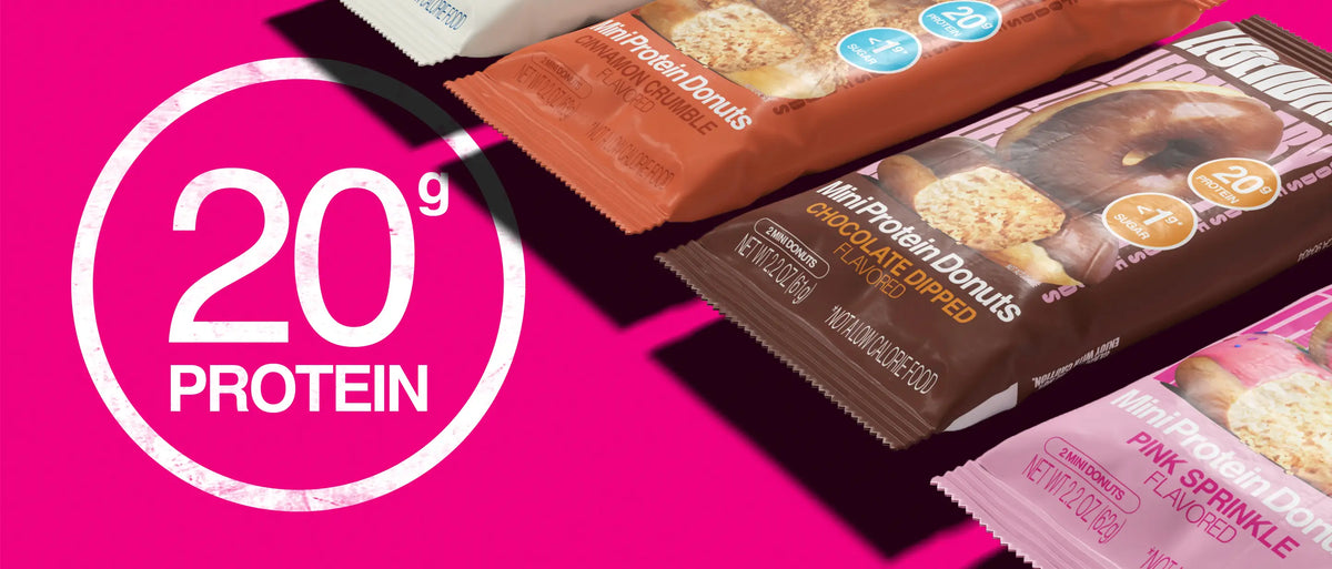 Mini Protein Donuts packaging on pink background highlighting 20g protein per serving across multiple flavors