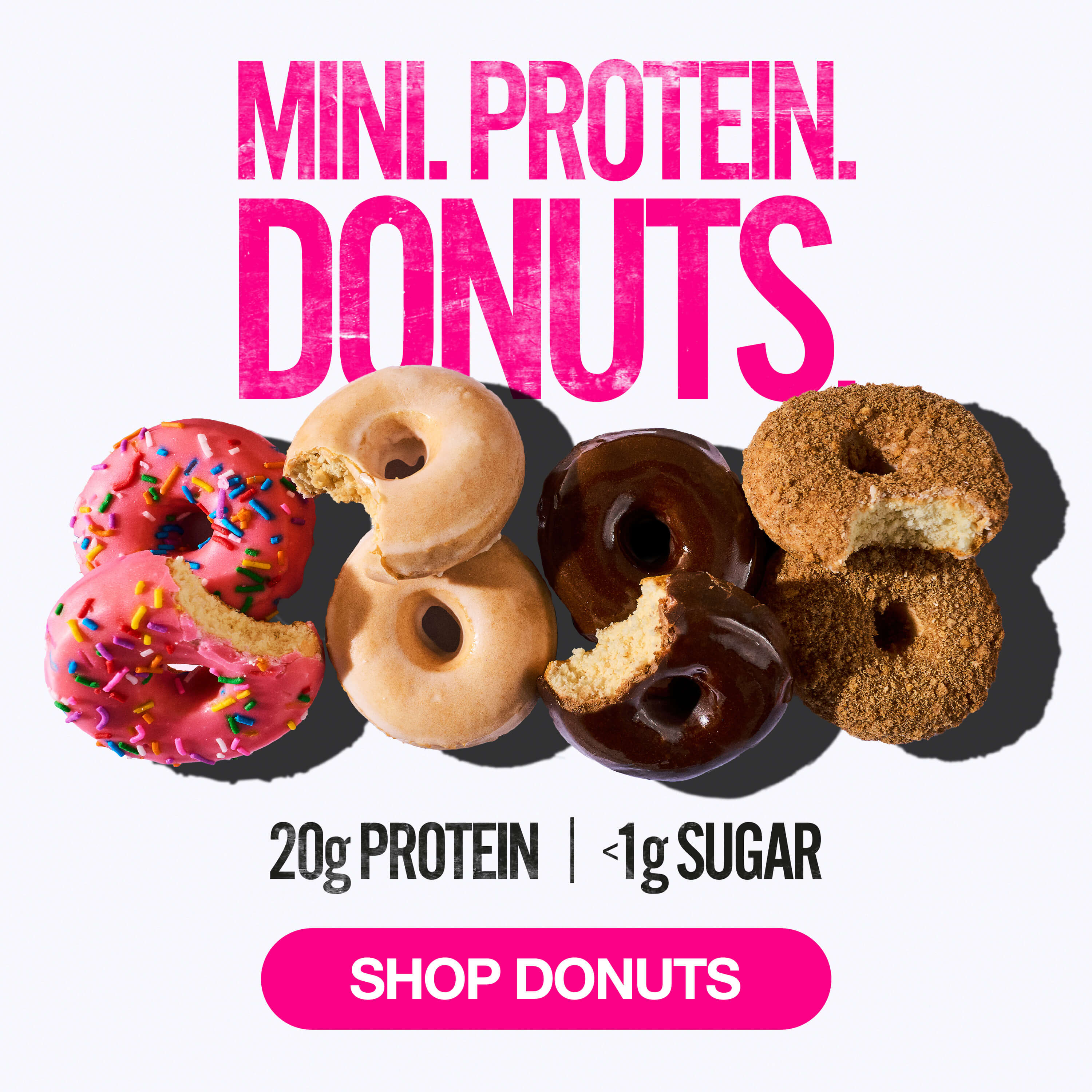 Assorted mini protein donuts with bites taken, showing texture; text reads “Mini Protein Donuts, 20g protein, <1g sugar, shop donuts”