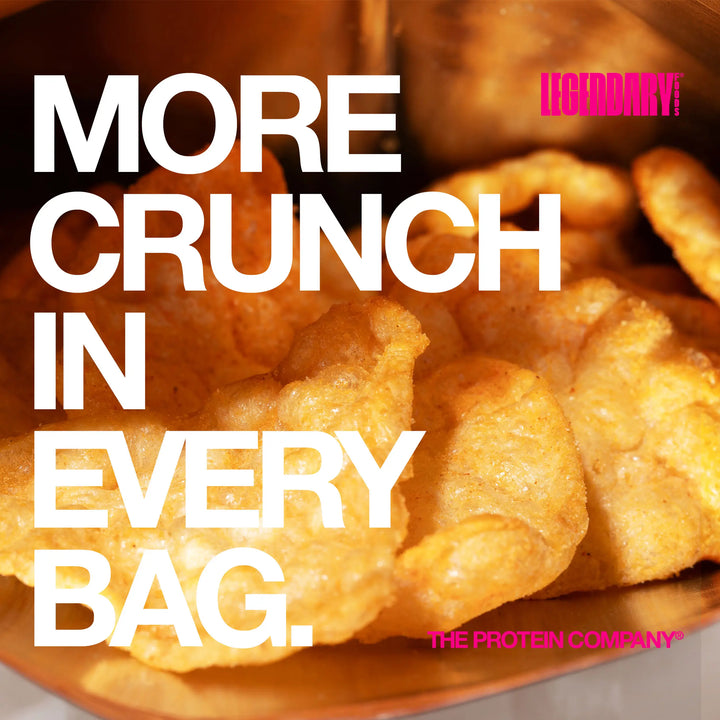 Extreme close-up of crispy nacho cheese protein chips spilling from bag with large text “More crunch in every bag”
