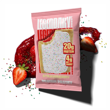 Pink package of Legendary Strawberry Protein Pastry with strawberries and sprinkles in the background.